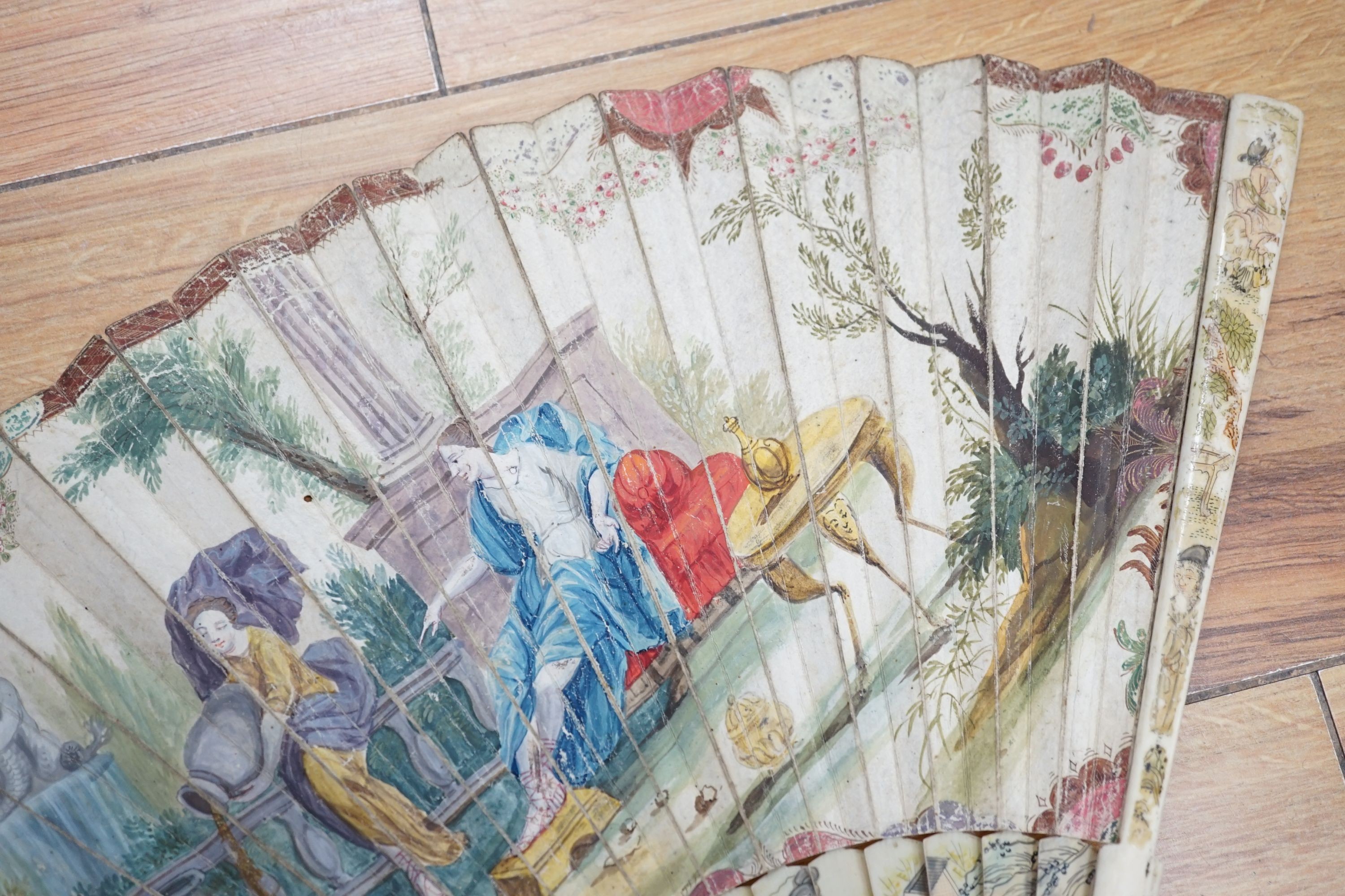 Five various fans, and an 18th century painted leaf fan with ivory chinoiserie decorated guards and sticks, 28 cms high (6)